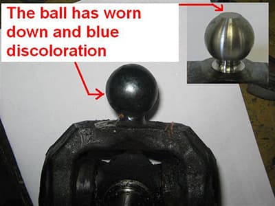 A close up image displaying a worn down and discolored PTO driveline ball due to lack of grease. The image also displays a what a greased PTO driveline ball should look like. Royal Bass and Hose advises keeping all PTO components well-greased. 